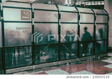 Outdoor smoking area under an overpass in the rain Outdoor smoking area under an overpass in the rain 126933119