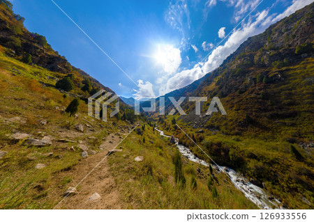 View Down Steep Mountain Gorge with Rushing River 126933556