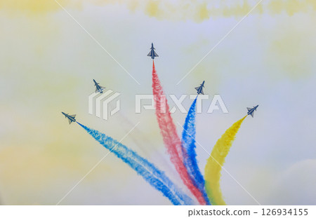 J-10 Acrobatic airshow team from China Air Force on formations with colorful smokes venting from the plane. J-10 Acrobatic airshow team from China Air Force on formations with colorful smokes venting from the plane. 126934155