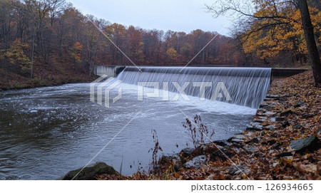 Majestic view of a massive concrete dam in a desert canyon 126934665