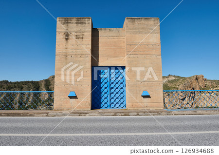 Concrete Structure with Blue Painted Door and Geometric Design Concrete Structure with Blue Painted Door and Geometric Design 126934688