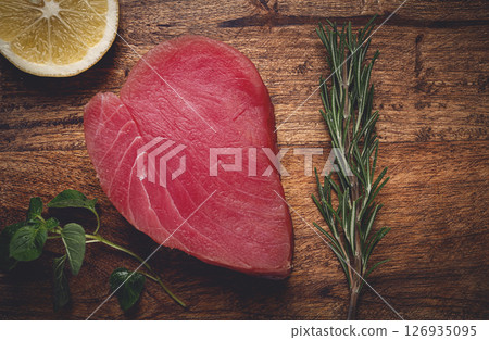 fresh red tuna fillet, for steak, raw, top view, on a cutting board, no people, 126935095