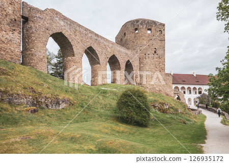 Venture to Velhartice Castle in Czechia to admire the impressive Gothic bridge and its historic architecture, surrounded by lush greenery and scenic pathways inviting exploration. Venture to Velhartice Castle in Czechia to admire the impressive Gothic bridge and its historic architecture, surrounded by lush greenery and scenic pathways inviting exploration. 126935172