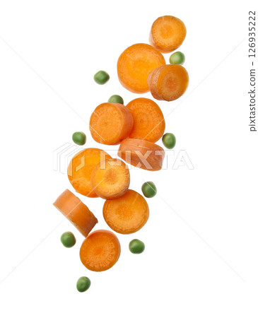 Falling carrots and green peas on white backgrounds Falling carrots and green peas on white backgrounds 126935222