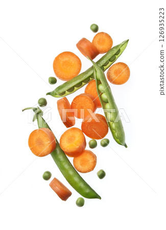 Levitation slick carrots and green peas on white backgrounds 126935223