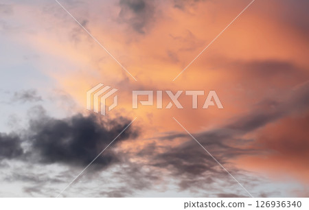 A sunset sky with soft clouds. 126936340