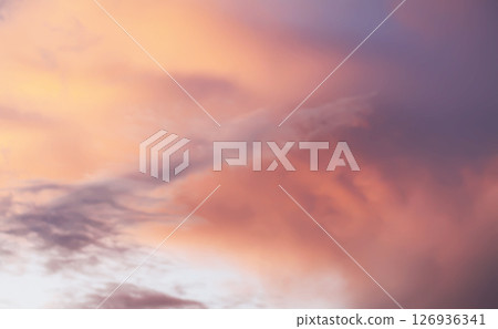 A sunset sky with soft clouds. A sunset sky with soft clouds. 126936341