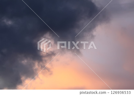 A sunset sky with soft clouds. A sunset sky with soft clouds. 126936533