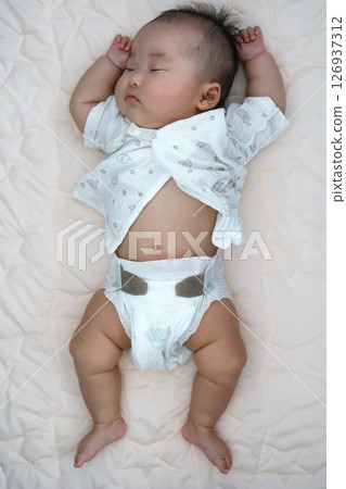 3-month-old baby sleeping on his stomach 126937312