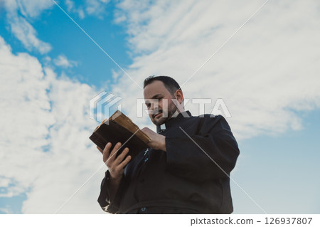 Paradise Clouds Behind A Deacon Praying God Paradise Clouds Behind A Deacon Praying God 126937807