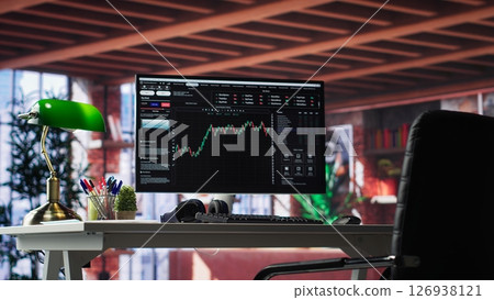 Modern trading setup with monitor running forex trends going up, high end classy apartment workstation. Clean desk provide a professional space for stock exchange analysis. Camera A. Modern trading setup with monitor running forex trends going up, high end classy apartment workstation. Clean desk provide a professional space for stock exchange analysis. Camera A. 126938121