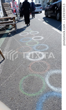 Parents and children walking on the road 126938413