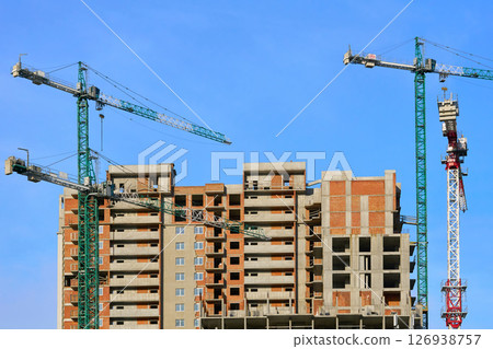 Construction site.New building.Large high rise cranes Construction site.New building.Large high rise cranes 126938757