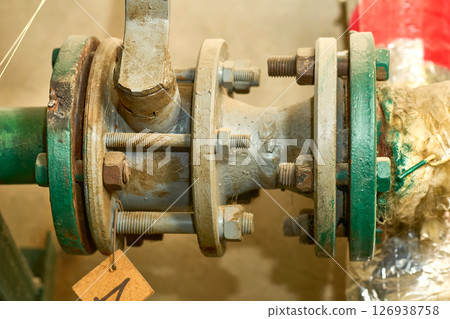 Basement.Plumbing sewage. Water valve, old rusty faucet Basement.Plumbing sewage. Water valve, old rusty faucet 126938758