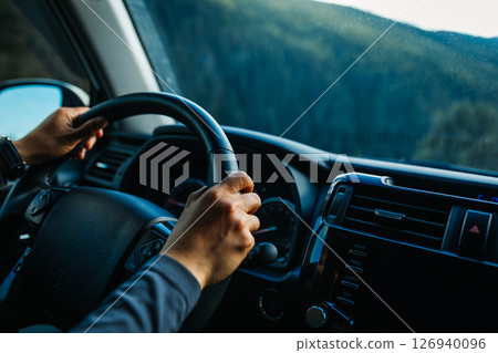 Driving offroad car on high elevation mountains 126940096