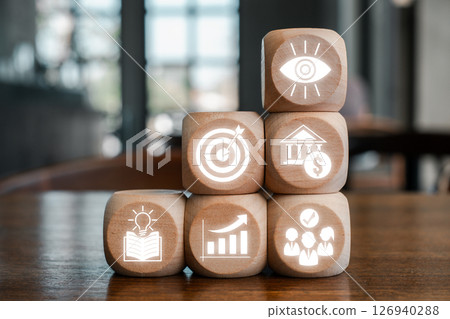 Wooden blocks with business icons representing the balanced scorecard concept for strategic management and performance evaluation. Wooden blocks with business icons representing the balanced scorecard concept for strategic management and performance evaluation. 126940288