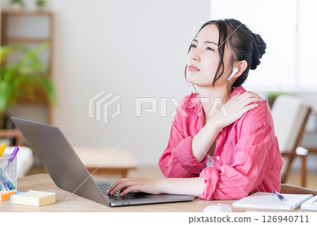 A young woman working from home. A young woman working from home. 126940711