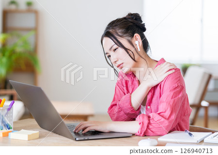 A young woman working from home. A young woman working from home. 126940713