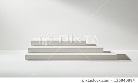 Three white platforms are stacked against an all white background Three white platforms are stacked against an all white background 126940994