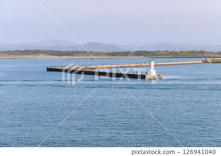 People enjoying sea fishing on the breakwater 126941040