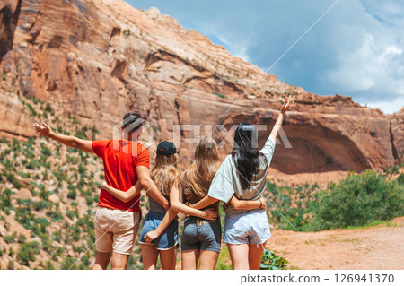 Family on trail at Fire Valley in Utah 126941370