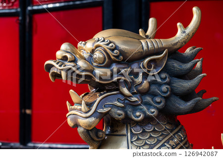 Golden Dragon Sculpture with Red Background Golden Dragon Sculpture with Red Background 126942087