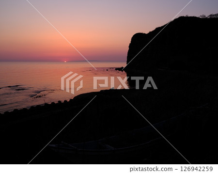 View of the sunset and the cliffs known as the Grand Canyon of the Orient from the Tatenomisaki parking lot in Otobe-cho, Ebisu-gun, Hokkaido View of the sunset and the cliffs known as the Grand Canyon of the Orient from the Tatenomisaki parking lot in Otobe-cho, Ebisu-gun, Hokkaido 126942259