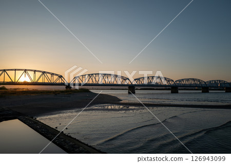 Yoshinogawa Bridge illuminated by the setting sun Yoshinogawa Bridge illuminated by the setting sun 126943099