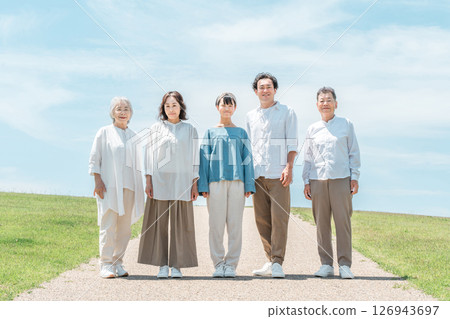 A happy family on a hill with a road, family, parents and children, three-generation family 126943697
