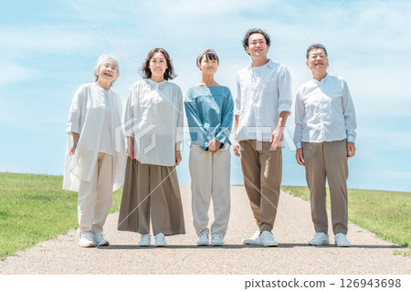 A happy family on a hill with a road, family, parents and children, three-generation family 126943698