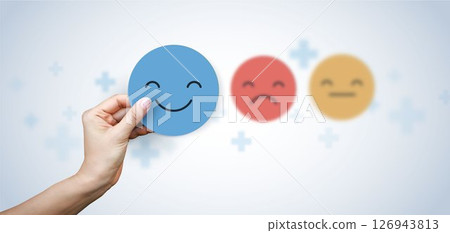 Medical concepts. doctor holding paper cut circle symbol face smile, happy, relax, satisfaction survey, positive, good, wellness, health child, hospital, world mental health day concept. Medical concepts. doctor holding paper cut circle symbol face smile, happy, relax, satisfaction survey, positive, good, wellness, health child, hospital, world mental health day concept. 126943813