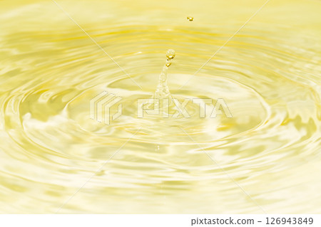 Drops of water falling on the surface of the water. 126943849