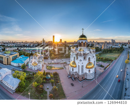 Summer Yekaterinburg, Temple on Blood and Church of St Nicholas in sunset. Aerial view of Yekaterinburg, Russia. Translation of text on the temple: Honest to the Lord is the death of His saints 126944810
