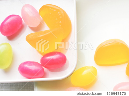 Colorful gummies on a white plate 126945170