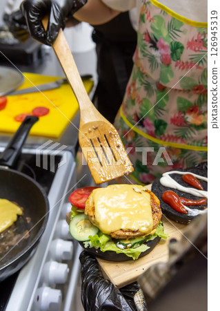 Burger Party. Fun Cooking Workshop for Teens in Cafe Burger Party. Fun Cooking Workshop for Teens in Cafe 126945319