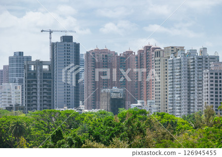 Modern downtown condominium building with plant tree park nature for fresh air green city Modern downtown condominium building with plant tree park nature for fresh air green city 126945455