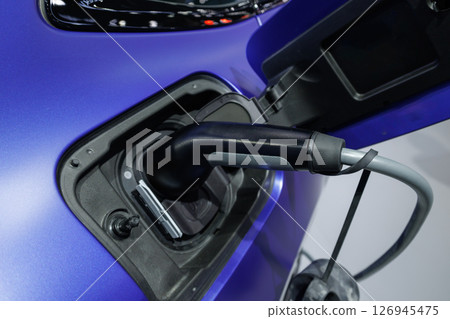 Plugin EV charging for electric car green power sustainable energy source zero emission vehicle 126945475