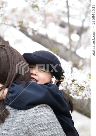 Cherry blossoms and a 3-year-old girl and her mother at the kindergarten entrance ceremony Cherry blossoms and a 3-year-old girl and her mother at the kindergarten entrance ceremony 126945533