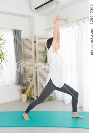 Young woman doing yoga poses Beauty image 126945569