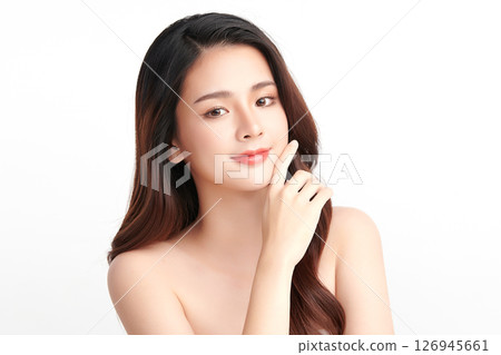 A beautiful young Asian woman with clean, fresh skin against a white background. Skincare, facial treatment, cosmetology, beauty, and spa. An elegant portrait of an Asian woman. A beautiful young Asian woman with clean, fresh skin against a white background. Skincare, facial treatment, cosmetology, beauty, and spa. An elegant portrait of an Asian woman. 126945661