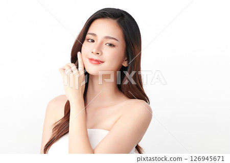 A beautiful young Asian woman with clean, fresh skin against a white background. Skincare, facial treatment, cosmetology, beauty, and spa. An elegant portrait of an Asian woman. A beautiful young Asian woman with clean, fresh skin against a white background. Skincare, facial treatment, cosmetology, beauty, and spa. An elegant portrait of an Asian woman. 126945671
