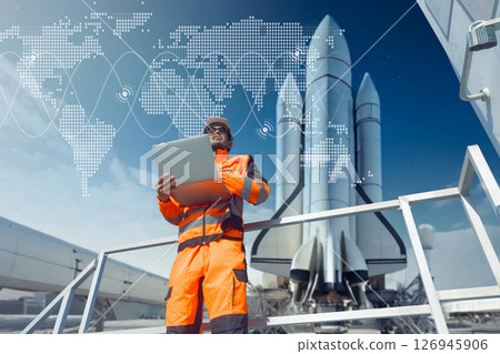 Professional engineer working in rocket lunch pad with laptop for control operate spaceship liftoff Professional engineer working in rocket lunch pad with laptop for control operate spaceship liftoff 126945906