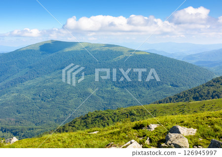 picturesque mountain landscape with rocks and grass. alpine scenery with wonderful view in to the valley. highland of ukraine in morning light. steep rolling hills picturesque mountain landscape with rocks and grass. alpine scenery with wonderful view in to the valley. highland of ukraine in morning light. steep rolling hills 126945997