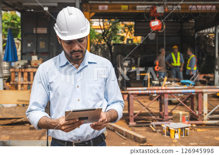 Portrait Hispanic Indian construction engineer male worker at construction site with safety hard hat 126945998