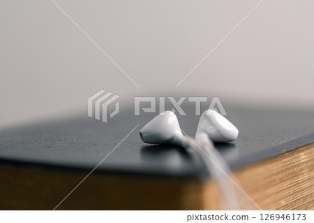 Close-up religious technology headphones pray bible church laptop Jesus Christ Holy Spirit Sunday service spiritual power blur background phone concept heaven belief gospel faith praise worship god Close-up religious technology headphones pray bible church laptop Jesus Christ Holy Spirit Sunday service spiritual power blur background phone concept heaven belief gospel faith praise worship god 126946173