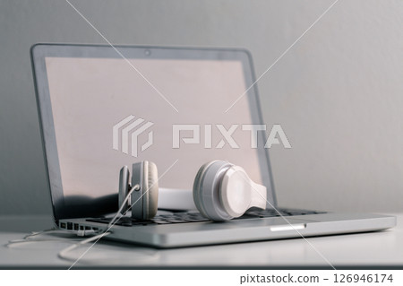 New technology modern Close up high resolution Wireless Earphones white Earbuds headphones black blur background Trendy minimal music device laptop concept phone accessories Comfortable Wooden table 126946174