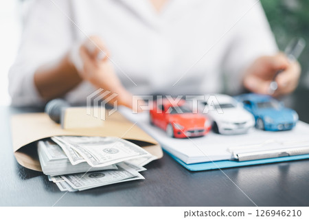 Businesswoman hand stamp approve on financial business approval document paper. Man hand accept permit contract agreement. Broker manager sign contract bank guarantee approved stamp application form 126946210