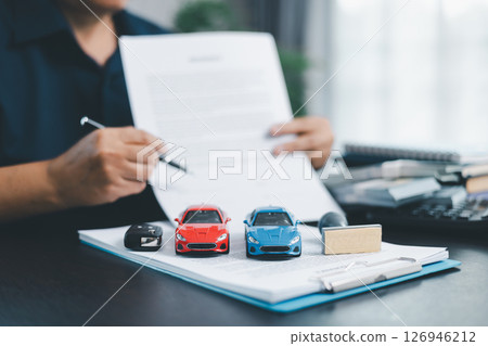 Businesswoman hand stamp approve on financial business approval document paper. Man hand accept permit contract agreement. Broker manager sign contract bank guarantee approved stamp application form 126946212