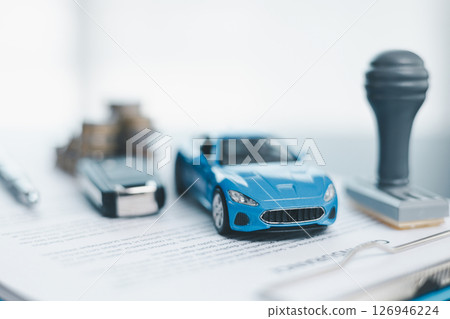 Approved car loan application with car key, rubber stamp and calculator concept. financial document on wooden table. Asset approval purchases to buy car. Ideas for car buying checklist loan tax Approved car loan application with car key, rubber stamp and calculator concept. financial document on wooden table. Asset approval purchases to buy car. Ideas for car buying checklist loan tax 126946224