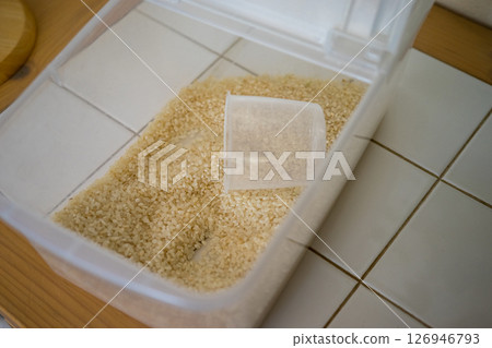 There is very little rice left in the rice bin 126946793